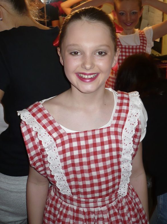 Olivia performing in a dance production as a child
